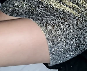Ultra-kinky nymph showing undies in gold micro-skirt